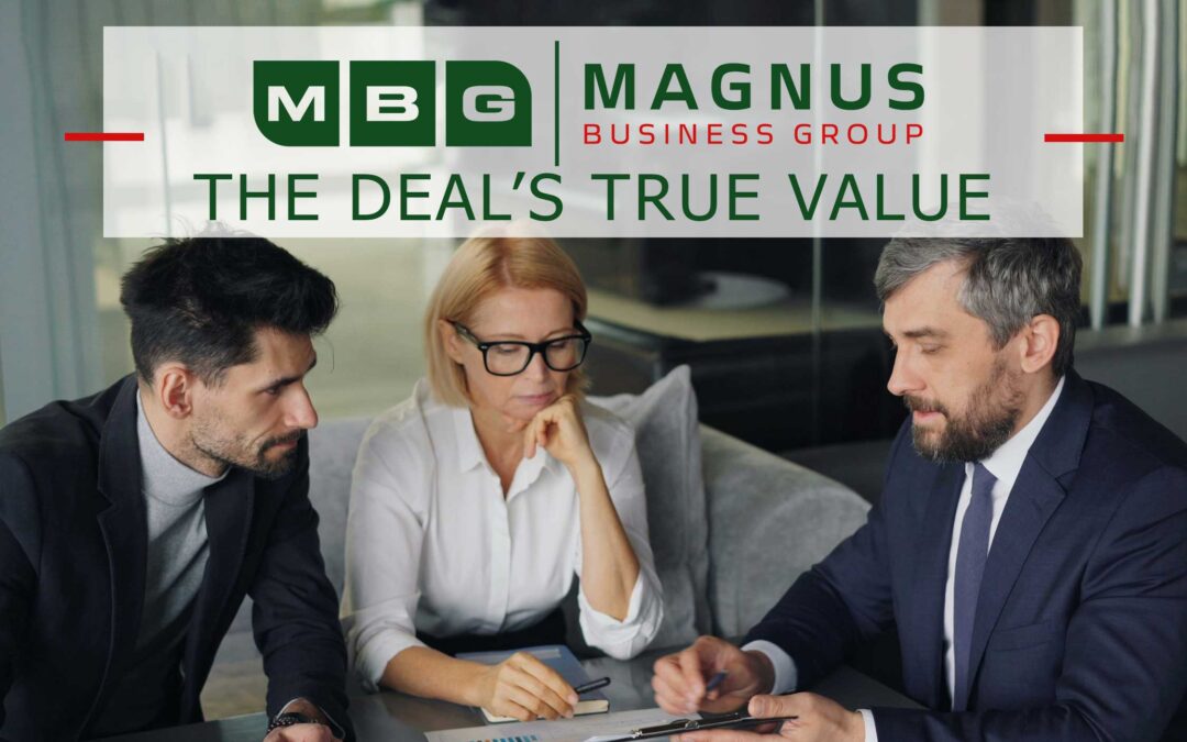 Business owner and advisors reviewing the terms of a business sale
